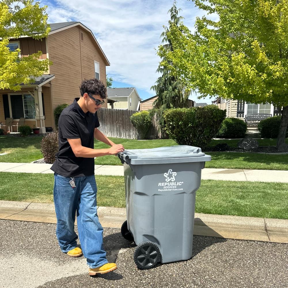 Zeke, owner of Bin Barber, standing with a cleaned curbside bin